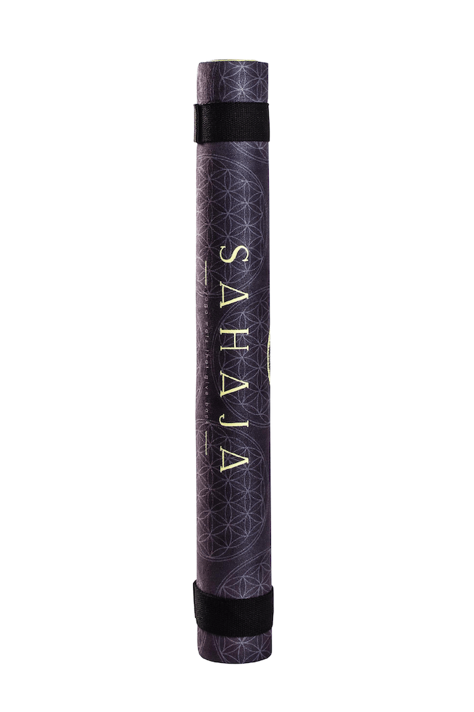 Sahaja Yoga Mats That Give Back. rolled up black yang travel yoga mat. Black with yellow flower of life, sacred geometry yoga mat that gives back with every purchase.