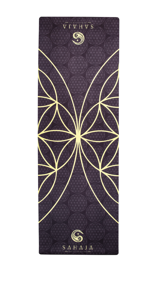 Sahaja Yoga Mats That Give Back. rolled out Yang travel yoga mat. Black with yellow flower of life, sacred geometry yoga mat that gives back with every purchase.